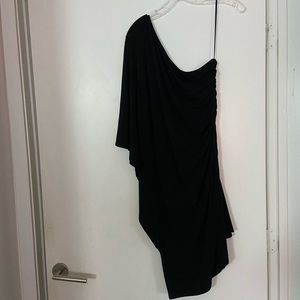 One sleeve bat style black dress with a golden zipper on the strapless side